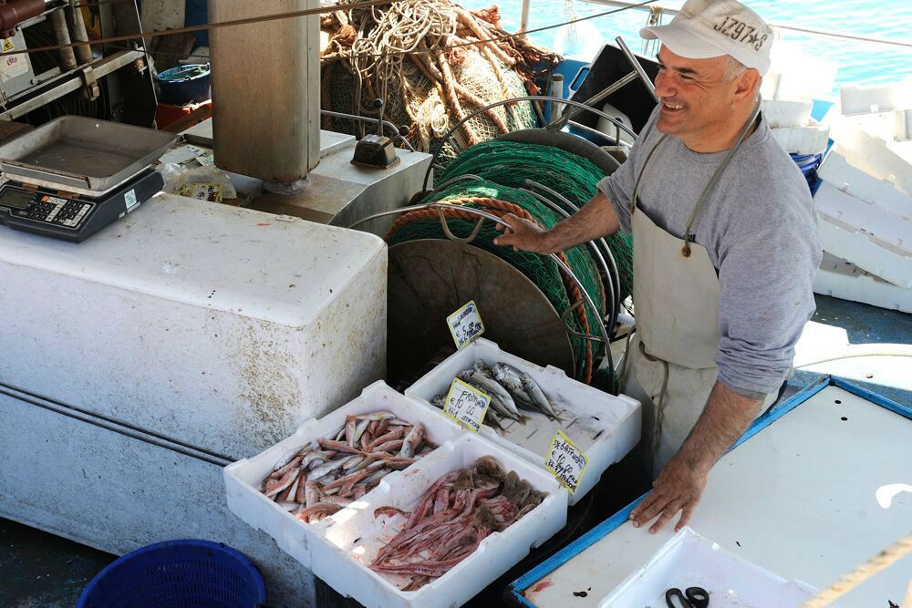 Some of the catch of this commercial fishing boat is reserved for selling to the locals.
