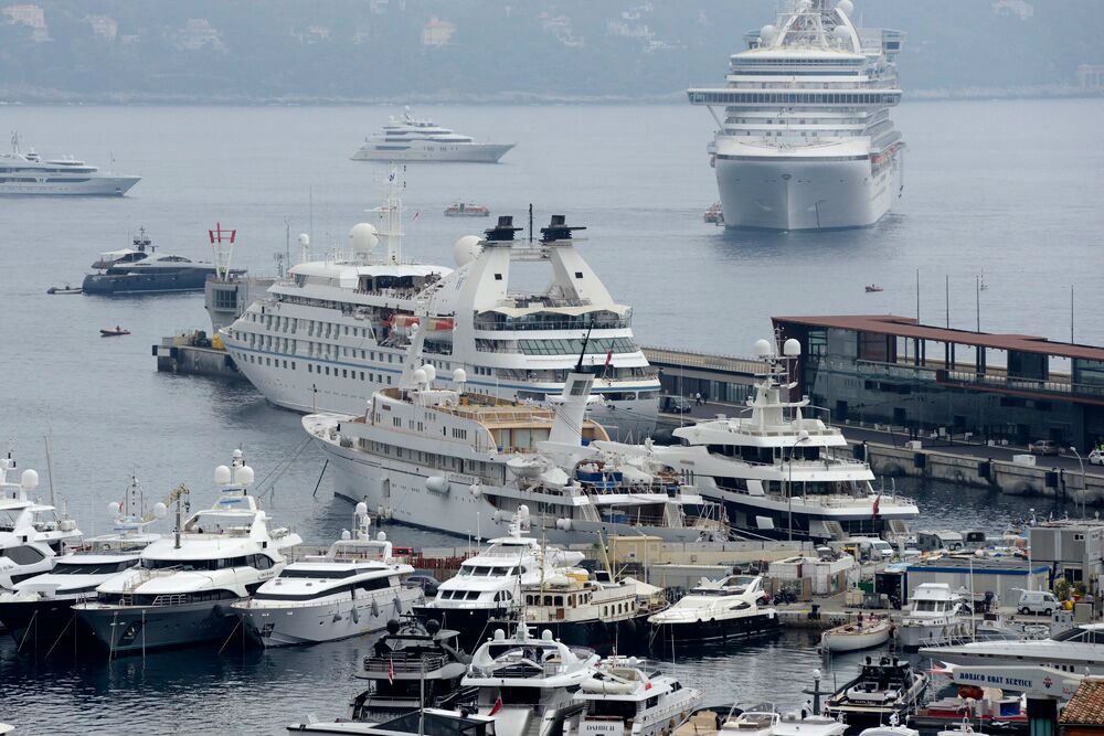 In Monte Carlo, Star Breeze docked at the marina, whereas a larger Royal Caribbean ship anchored.