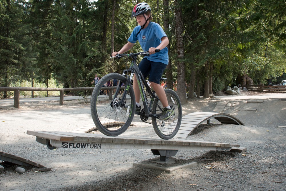 Doug tries his balance on a teeter-totter in Whistler’s bike-skills park. Photo: Tim Baker.