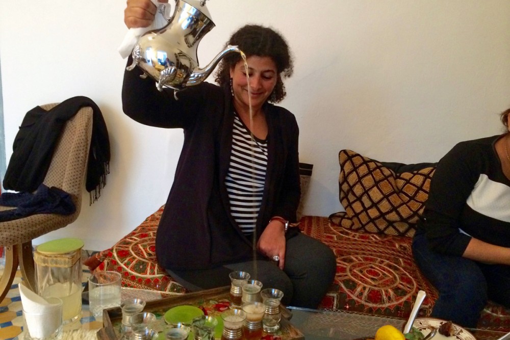 Aya pouring tea the Moroccan way.