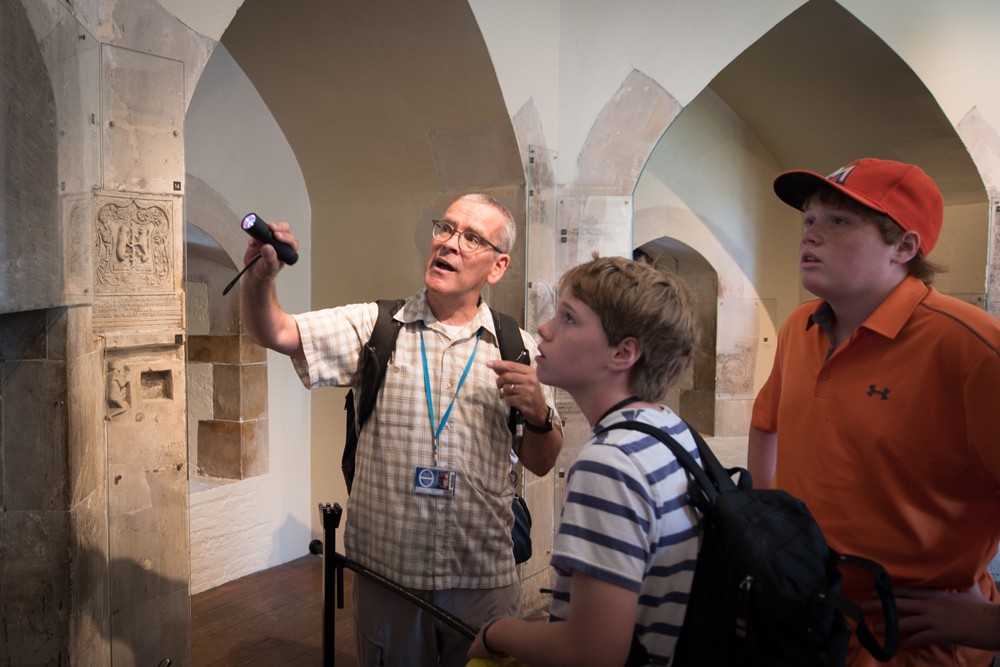 In the Tower of London our guide, Sean Moran, showed us “graffiti” carved by prisoners centuries ago.