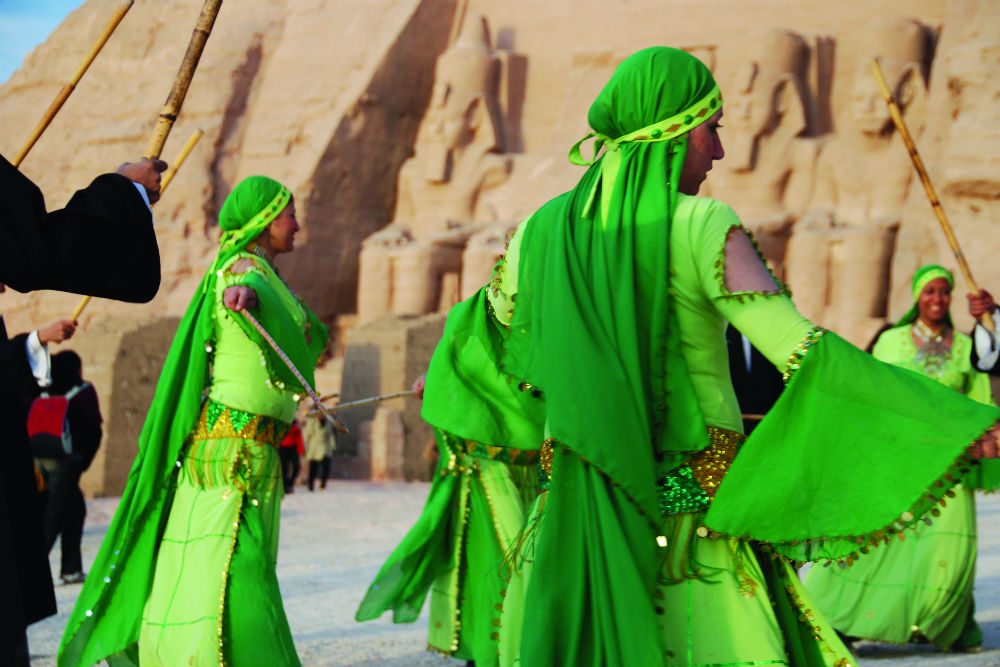 women in green dresses dancing in Egypt