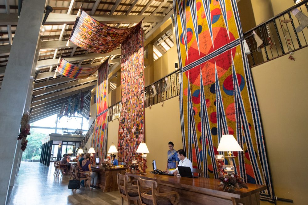 Clue #2: Note the open-air design of the resort’s lobby and its batik textiles.