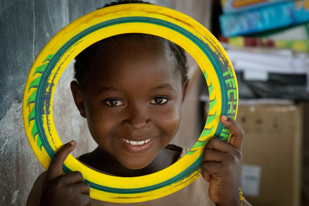 Zambia Chiawa girl with Frisbee ring
