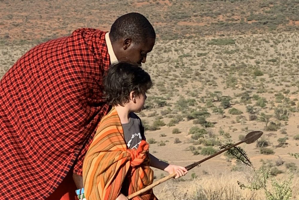 Kenya Maasai Warrior with tourist child