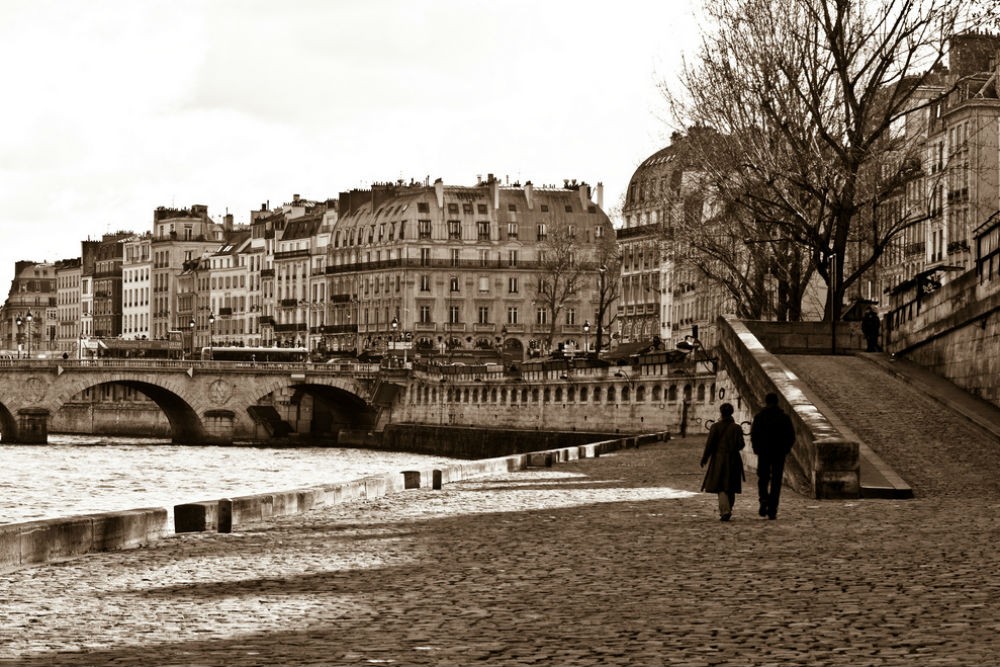 Romantic couple walkng through Paris France