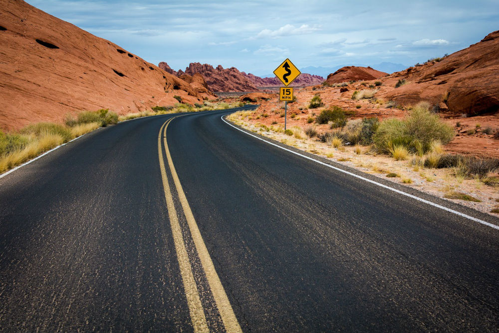 road trip on a winding desert road