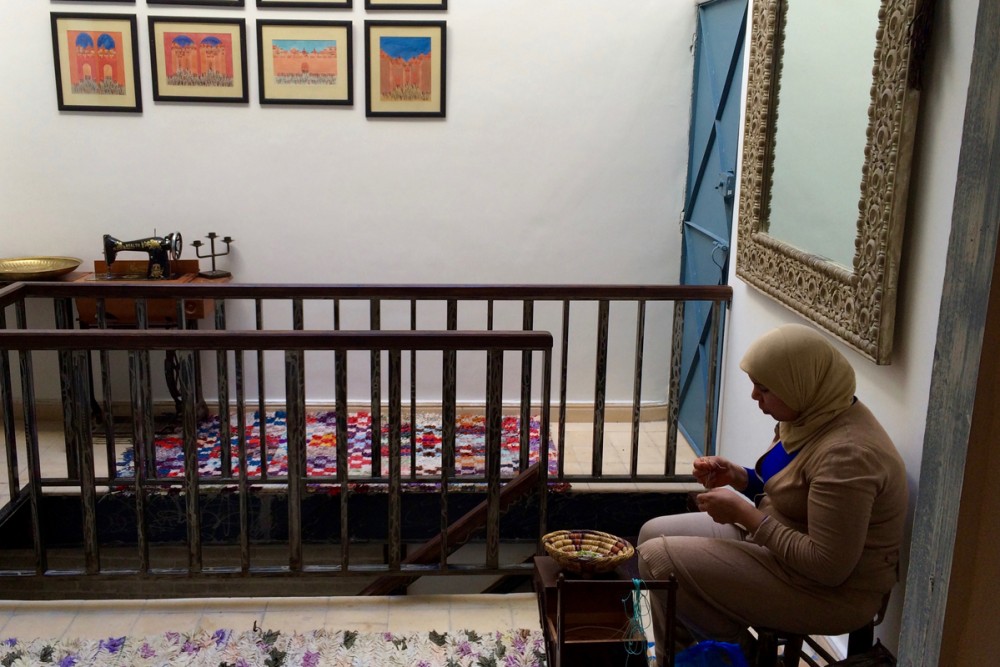 A seamstress in Nawal's studio.