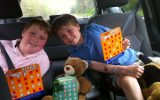 young boys in backseat of car family road trip
