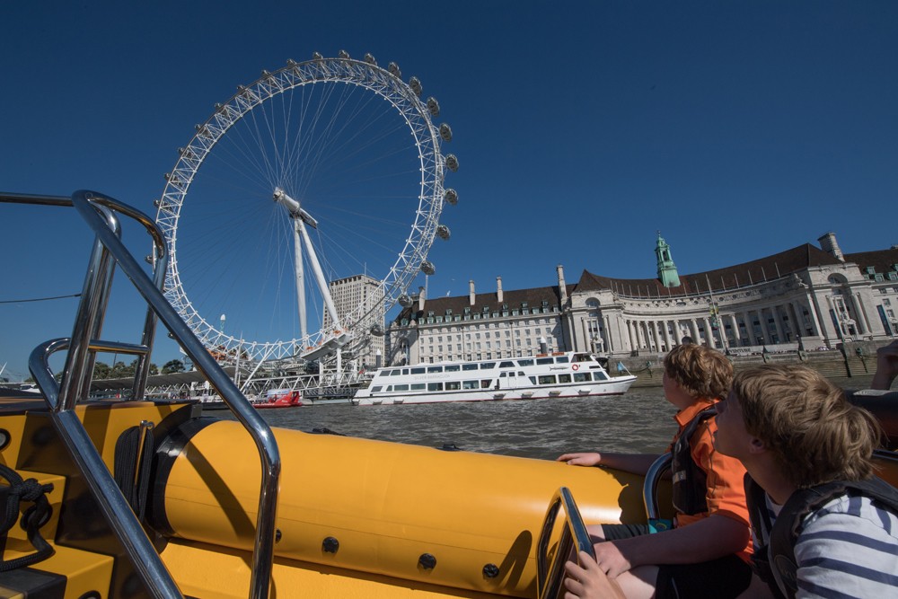 A rib ride on the Thames River is a fun way to see waterfront sights such as the London Eye.