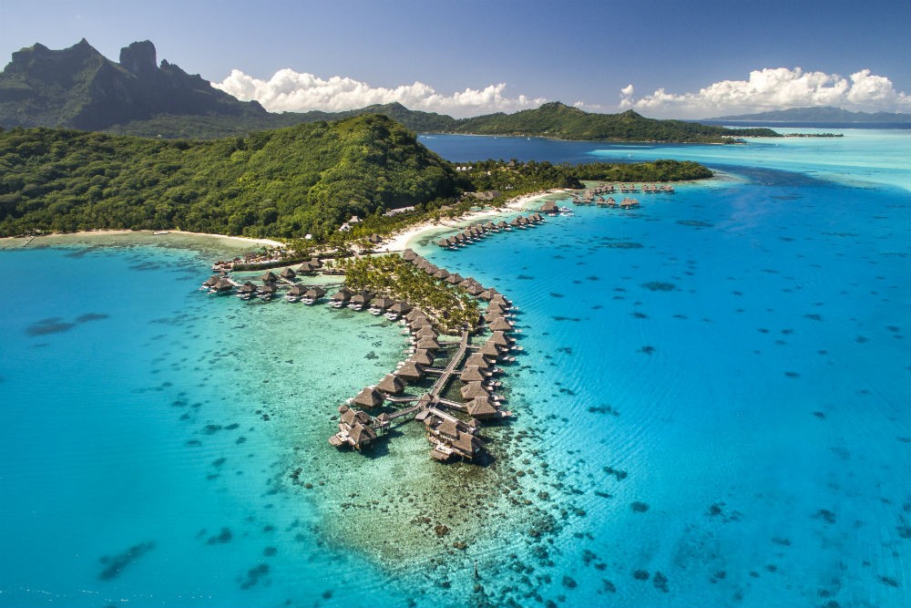 overwater bungalows in French Polynesia at the Conrad Hilton Bora Bora