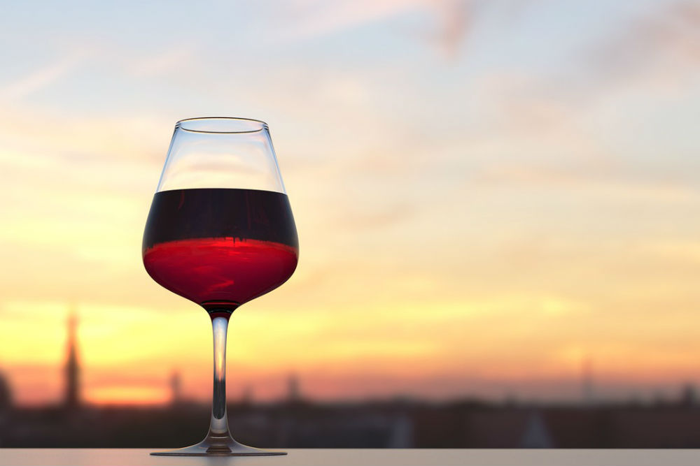 red wine glass at sunset