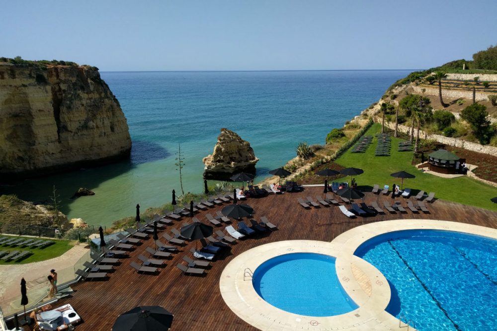 View of the pool and sea from the bar deck at the Tivoli Carvoeiro Algarve Resort, Portugal