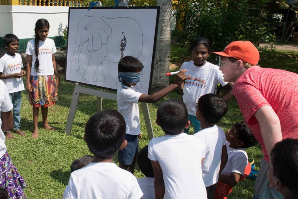 We brought gifts and played games. This is Pin the Eye on the Elephant.