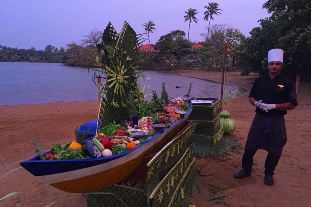 Check out the canoe filled with fresh-caught seafood to be grilled.