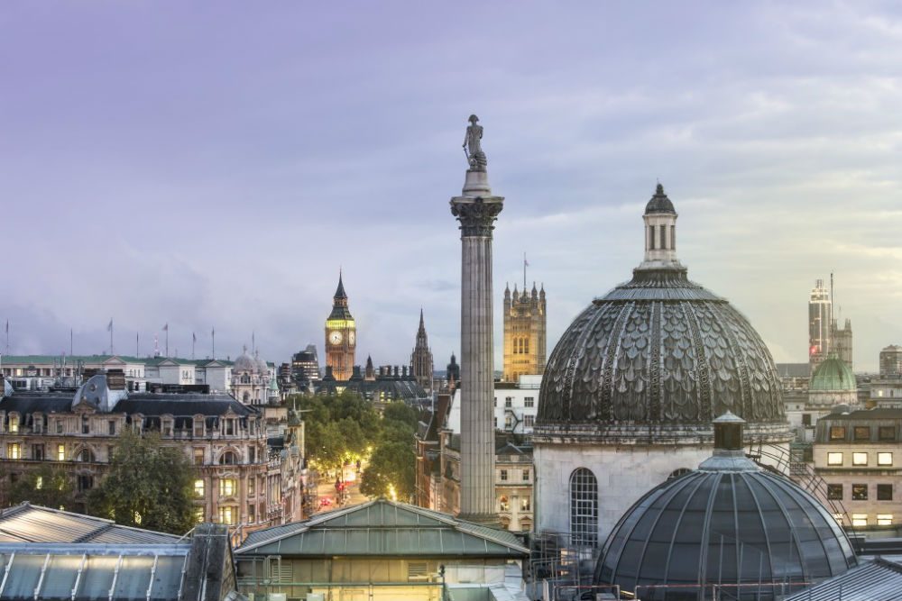 London skyline with Nelson's Column and Big Ben at dusk