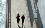 joggers on promenade of crystal serenity cruise ship