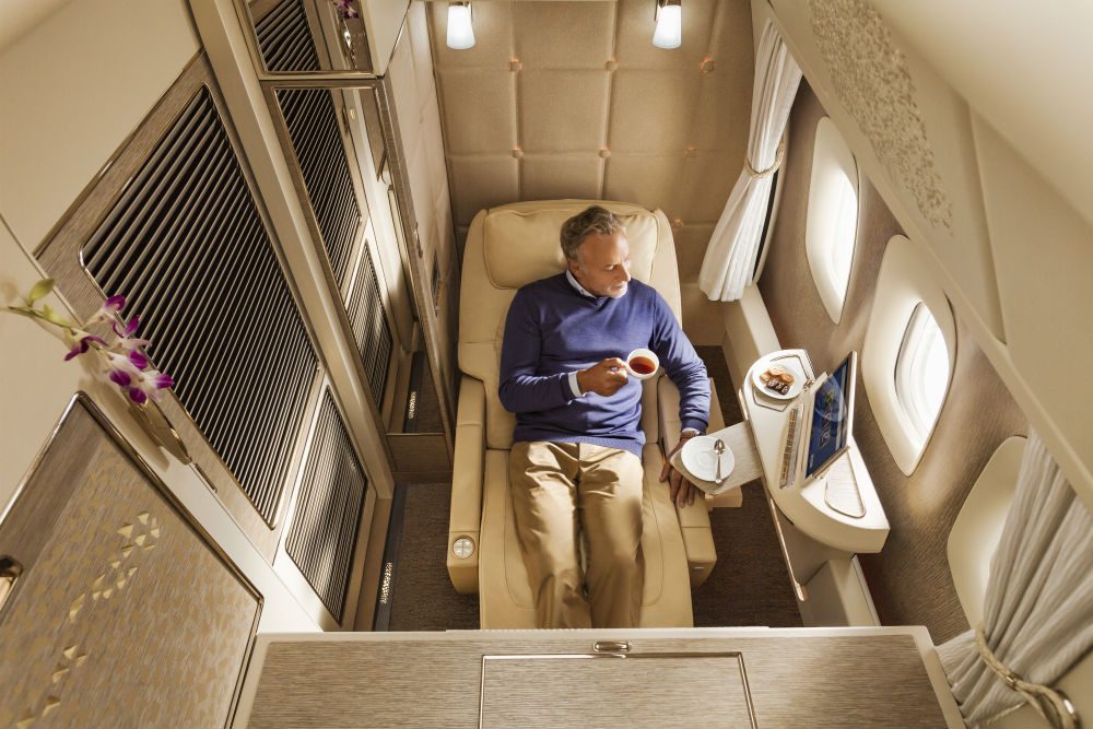 Emirates' first class rooms with floor-to-ceiling walls and fully flat beds. Photo: Emirates