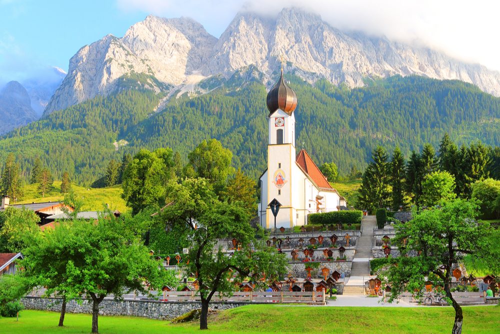 View of Grainau's church with the Zugspitze behind. It is Germany's highest peak