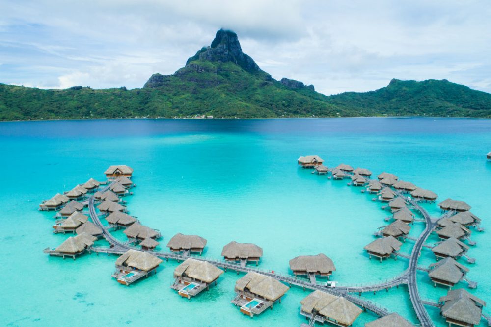 overwater bungalows aerial view Brando Suites, Bora Bora.