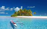 Fakarava island in french polynesia with canoe on turquoise blue water