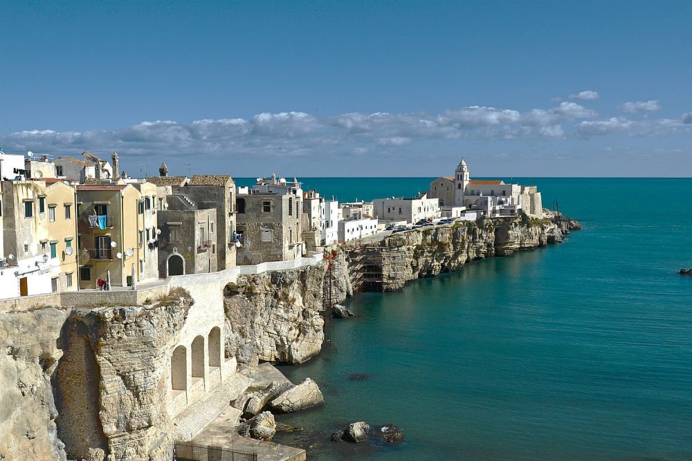 Vieste village of white buildings on a spit reaching into the ocean, Gargano National Park italy