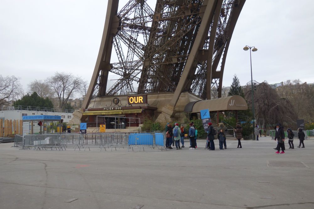 The line for stair-and-elevator tickets up the Eiffel Tower in Paris