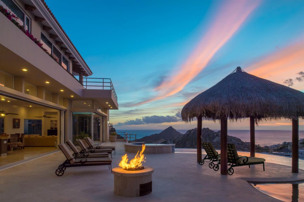 a villa with a firepit and pool in Cabo Mexico