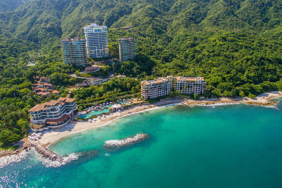 aerial view of Garza Blanca Preserve Resort in Puerto Vallarta Mexico with ocean and jungle mountains