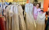 Unclaimed Baggage Center Wendy with wedding gowns