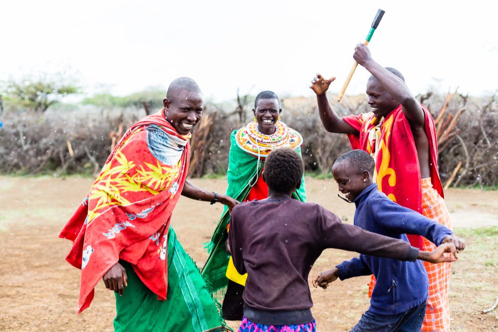 Maasai family celebrating and dancing Kenya