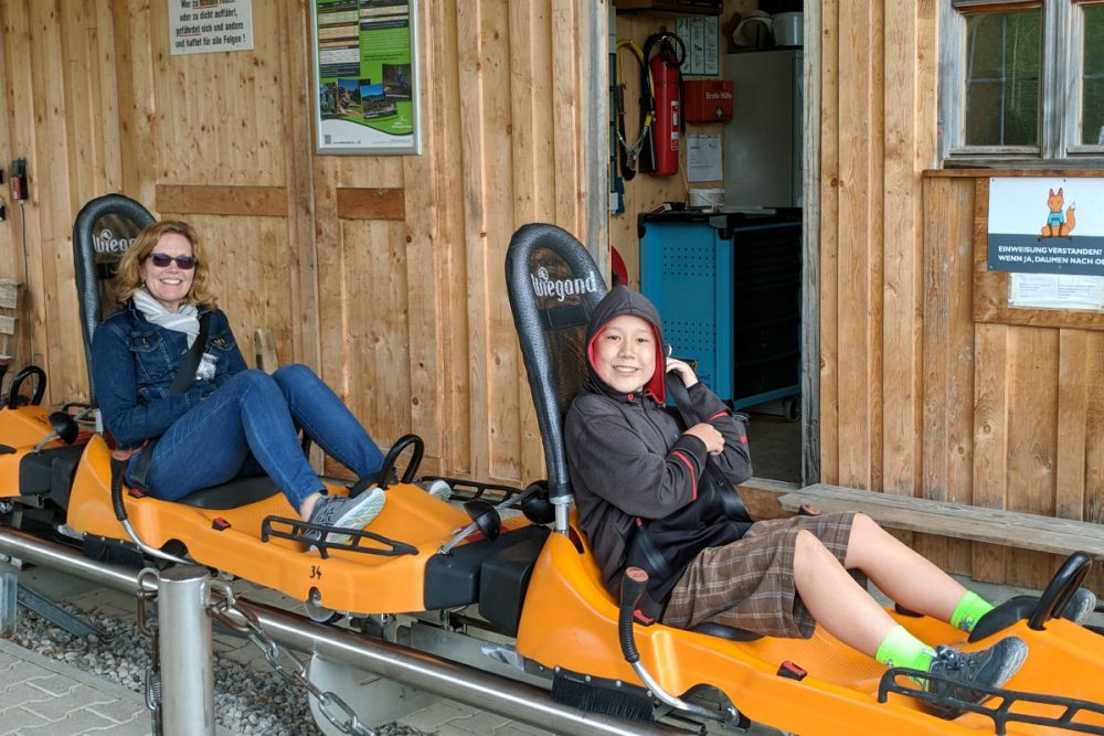 tourist family in sleds in Bavaria