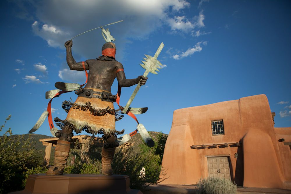 Apache Mountain Spirit Dancer statue in front of the Museum of Indian Arts and Culture in Santa Fe New Mexico