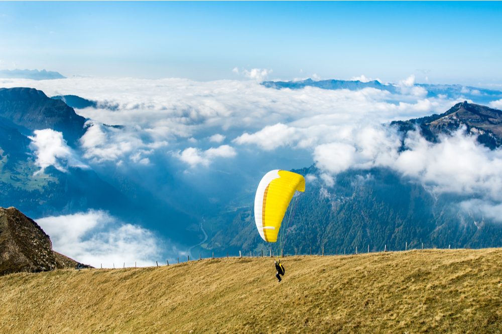 Start of paraglider at Mannlichen top point above Grindelwald, Switzerland. - Image