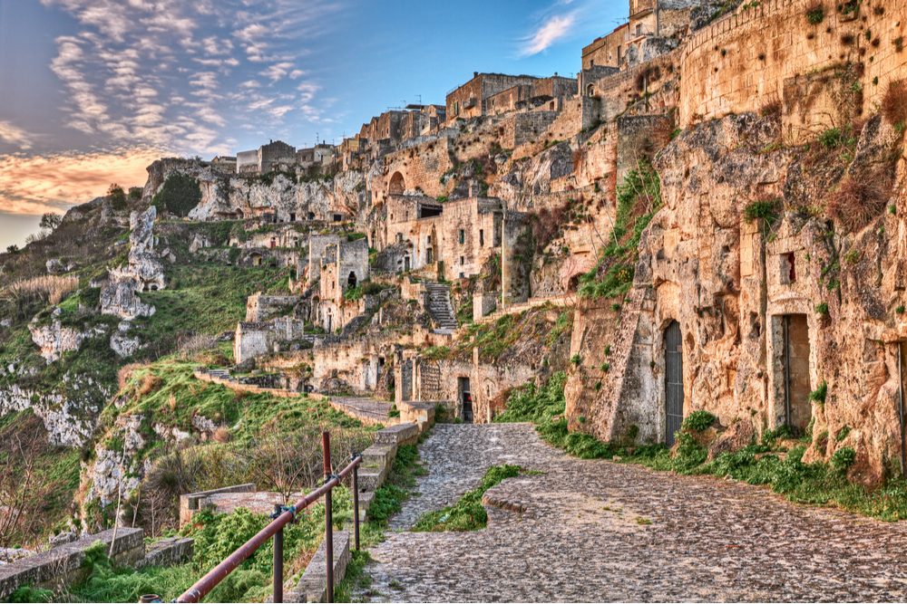 Matera, Basilicata, Italy: landscape at sunrise of the old town (sassi di Matera), with the ancient cave houses carved into the tufa rock over the deep ravine