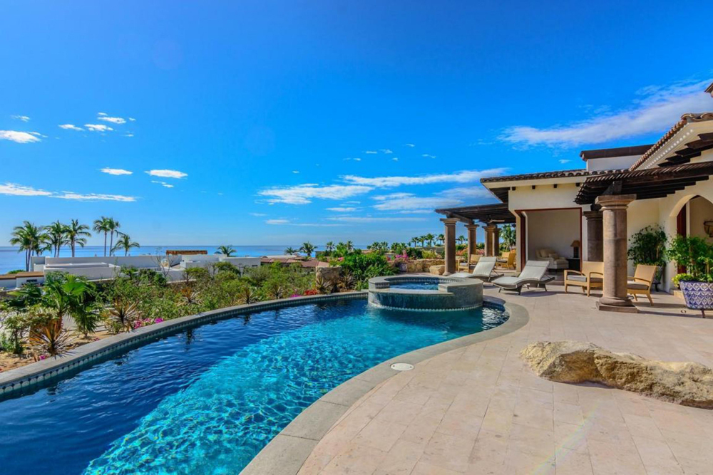 infinity pool and lounge deck at villa in Los Cabos Mexico