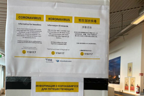 Norwegian language sign warning people about coronavirus in Kirkenes Airport Norway