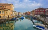 venice murano island canal with boats and no crowds