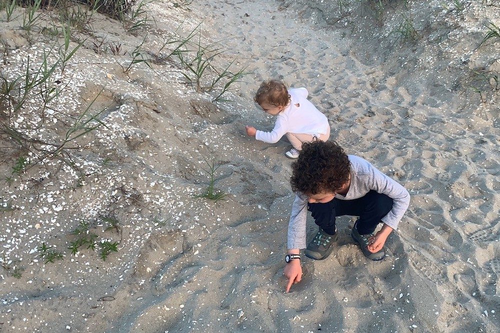 kids playing in sand at beach in Chincoteague Virginia