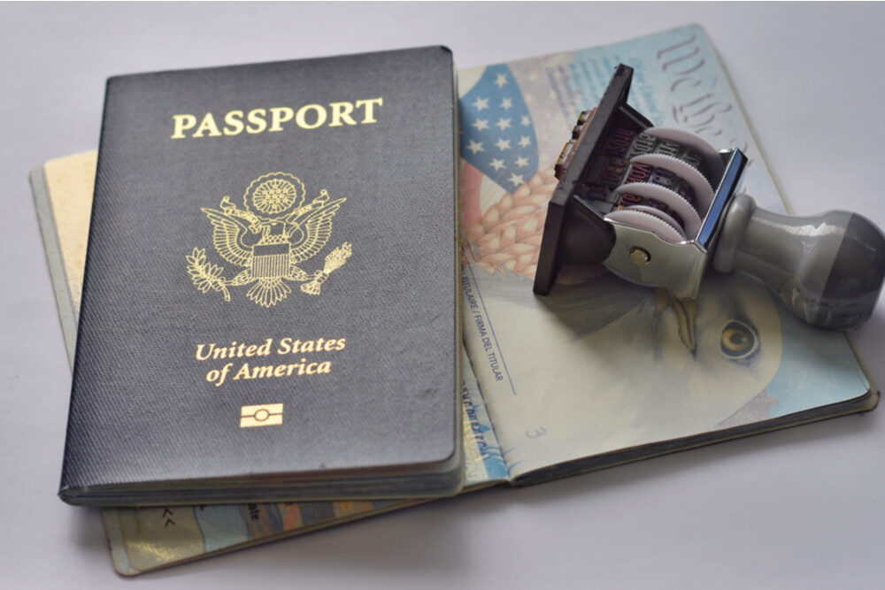 U.S.A. passport and rubber stamp on page of passport.Travel concept