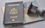 U.S.A. passport and rubber stamp on page of passport.Travel concept