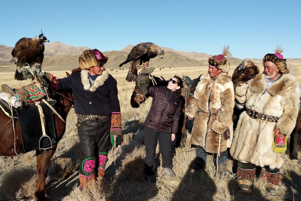 Golden Eagle Festival Mongolia - woman holding eagle