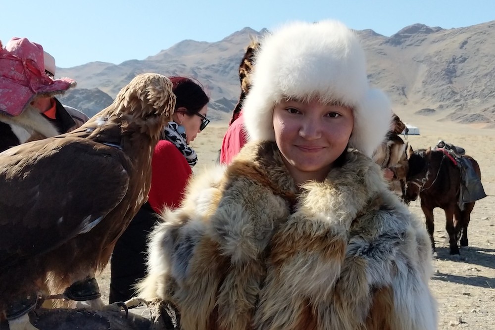 Golden Eagle Festival Mongolia - teen girl eagle hunter Akhelik 