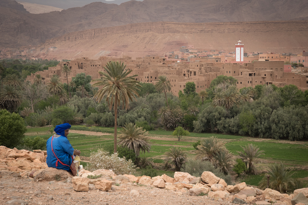 man looking over ancient village in Morocco