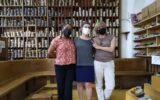 3 women posing at La Manual Alpargatera, oldest espadrilles shop in Barcelona