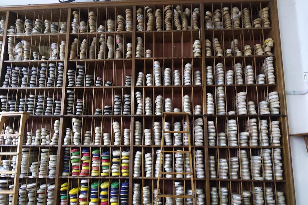 wall of shoes up to the ceiling at La Manual Alpargatera, oldest espadrilles shop in Barcelona