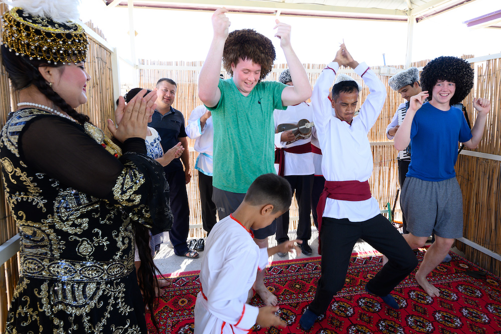 american teenage boys learning to dance in Khiva Uzbekistan