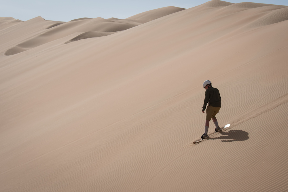 sandboarding in Abu Dhabi desert