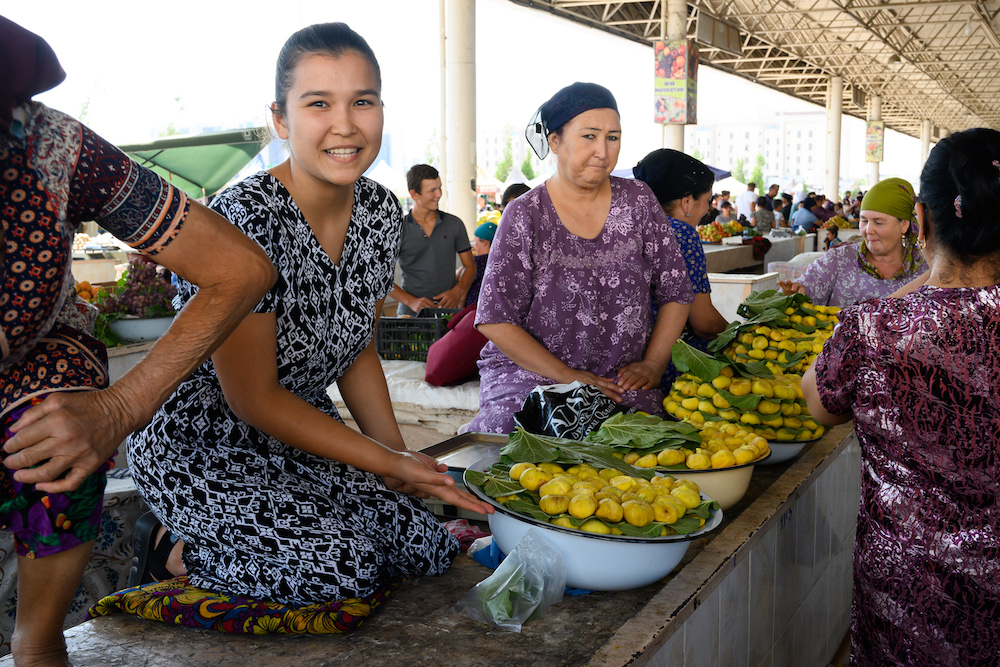 uzek women with bowls of yellow figs