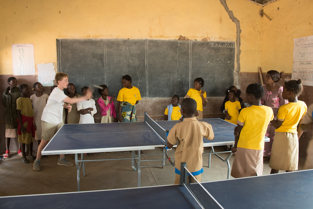 kids playing ping pong at a school in Chiawa Zambia 